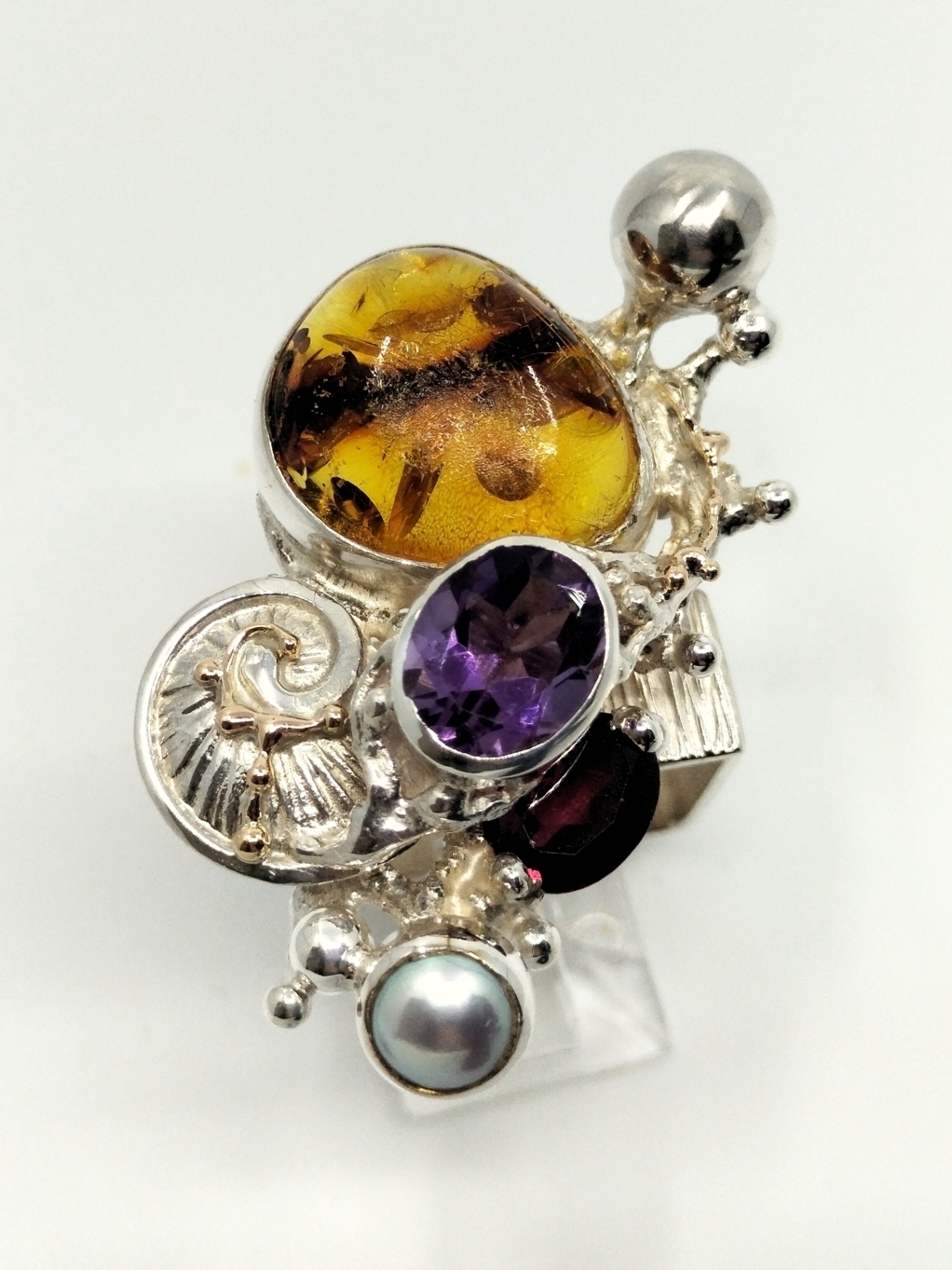 original maker's handcrafted jewellery, gregory pyra piro ring 1710, mixed metal jewelry, 14k gold and silver, sterling silver and 14 karat gold, artist with own style, unique style jewelry, silver and gemstone jewelry, gemstone and pearl jewelry, gold and color gemstone jewelry, amber, garnet, amethyst, pearl, art nouveau inspired fashion jewelry, jewellery with natural pearls and semi precious stones, contemporary jewelry from silver and gold, art jewellery with colour stones, contemporary jewelry with pearls and color stones, jewellery made from silver and gold with natural pearls and natural gemstones, shopping for diamonds and designer jewellery, accessories with color stones and pearls, artisan handcrafted jewellery with natural gemstones and natural pearls, jewelry made first hand, art and craft gallery artisan handcrafted jewellery for sale, jewellery with ocean and seashell theme