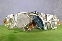 jewelry shown in international jewelry fairs and and exhibitions, bracelet handcrafted and made by artist, bracelets sold in art and craft galleries, mixed metal handcrafted jewelry, bracelet made from silver and gold, gregory pyra piro handcrafted bracelet 8032