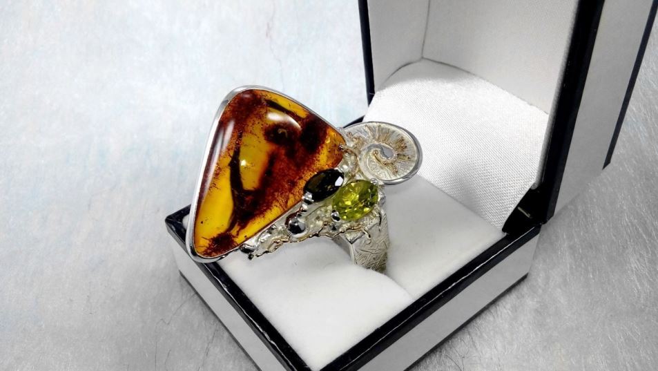 original maker's handcrafted jewellery, gregory pyra piro ring 30164, sterling silver and 14 karat gold, amber, peridot, green tourmaline, art nouveau inspired fashion jewelry, jewellery with natural pearls and semi precious stones, contemporary jewelry from silver and gold, art jewellery with colour stones, contemporary jewelry with pearls and color stones, jewellery made from silver and gold with natural pearls and natural gemstones, shopping for diamonds and designer jewellery, accessories with color stones and pearls, artisan handcrafted jewellery with natural gemstones and natural pearls, jewelry made first hand, art and craft gallery artisan handcrafted jewellery for sale, jewellery with ocean and seashell theme