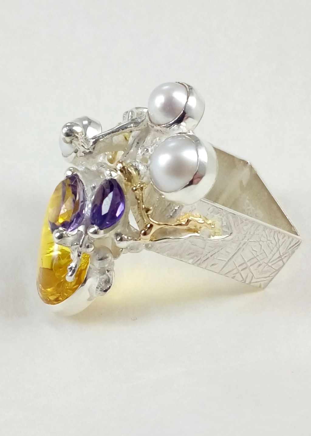 jewelry made from gold and silver, jewelry with color stones, jewelry with real pearls, gregory pyra piro square ring #5631, sculptural jewellery with ocean theme, antique motif inspired ring, sterling silver and 14k gold artisan jewellery, auction house with contemporary jewellery, color gemstone jewelry made by artistjewelry with detailed design, how to bid on auctions with collectibles and fine jewellery, shop for fine craft and collectibles, galleries with handcrafted jewellery for mature womens, antique style handcrafted jewellery, if you like antique jewellery you will like Gregory Pyra Piro art jewellery, jewelry with detailed design, real natural pearls and semi precious stone jewellery, fine jewellery with gemstones for auctions, silver and gold jewellery for auctions, fine contemporary jewellery collectible, jewellery collectibles for auctions, handcrafted collectibles, handcrafted collectibles, rings for women with two amethysts and pearl, jewellery with amber and amethysts, fine craft gallery handcrafted ring for sale, sterling silver and 14 karat gold ring