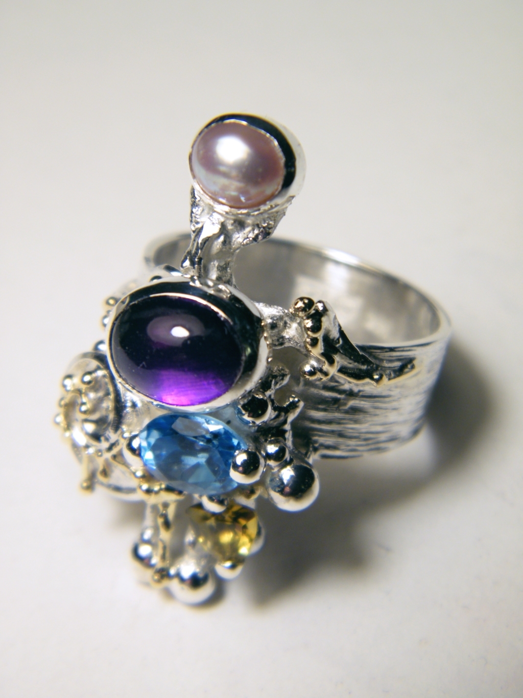 gregory pyra piro one of a kind ring 4020, mixed metal one of a kind jewellery, silver and gold mixed metal jewellery, rings for women with blue topaz and pearl, rings for women with amethyst and peridot, rings for women with blue topaz and peridot, rings for women with amethyst and blue topaz, rings in art and craft galleries
